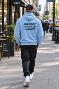 Back view of I am Wealthy printed pullover hoodie showing clean minimalist graphic design layout