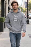 Model styling a comfortable streetwear slogan hoodie with a front pouch pocket