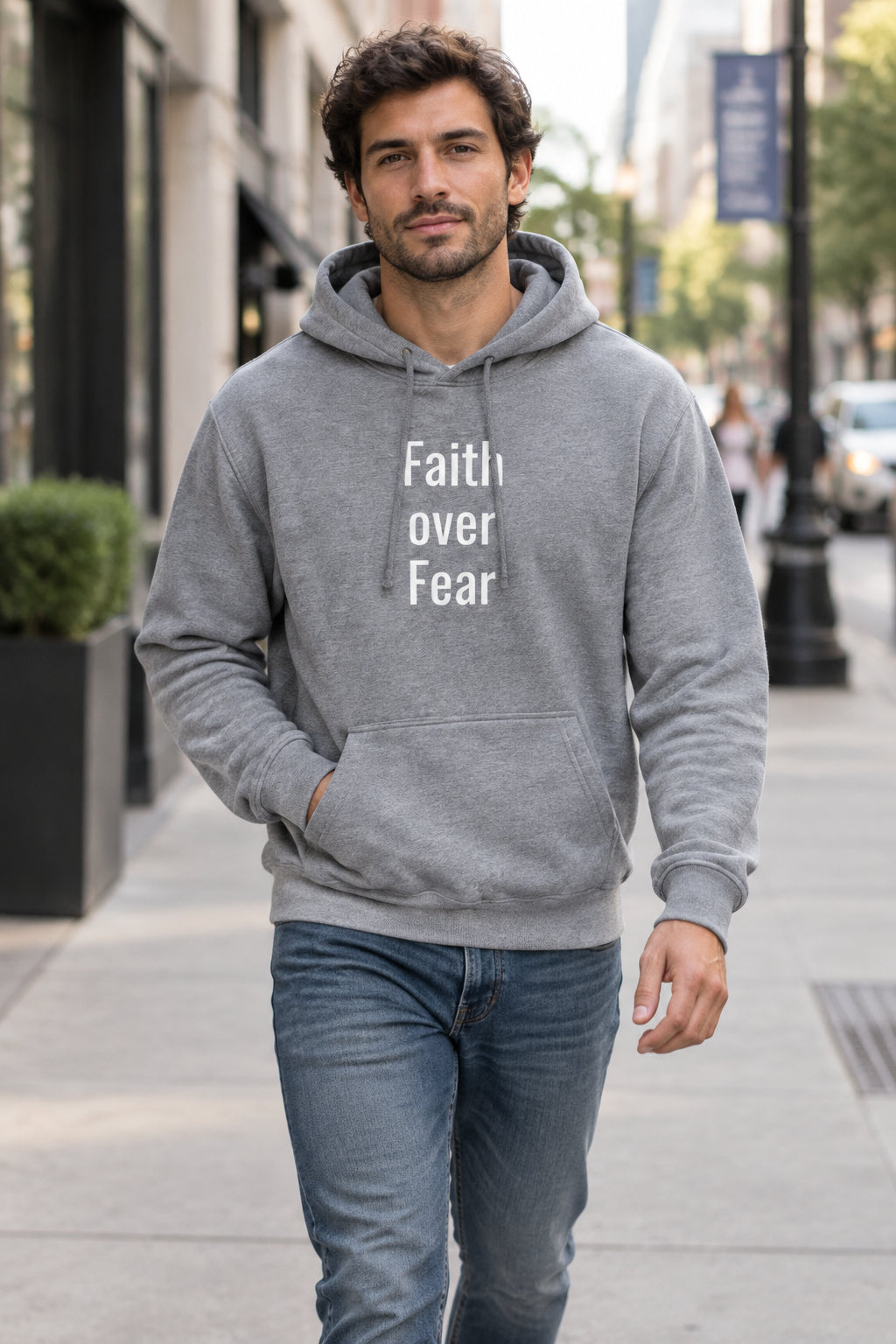 Model styling a comfortable streetwear slogan hoodie with a front pouch pocket