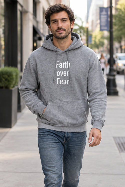 Model styling a comfortable streetwear slogan hoodie with a front pouch pocket