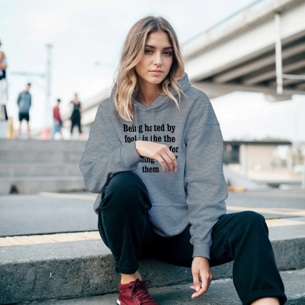 Front view showcase of Being hated by fools printed hoodie showing clean typography layout